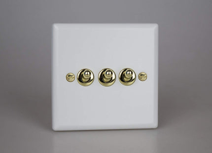 Varilight Vogue Collection Matt White 3 Gang 1 or 2-Way 10 Amp Toggle Switch with Brass Toggle